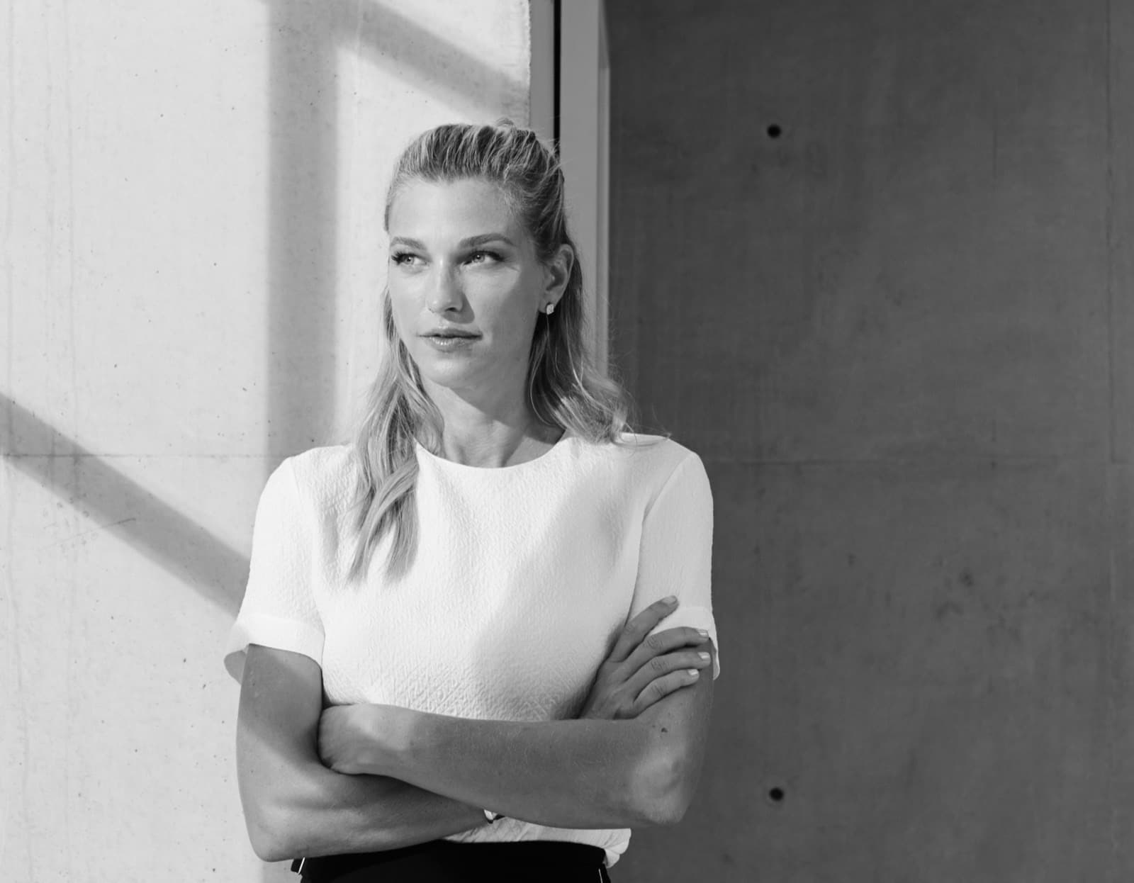 Nicole Junkermann in a cream blazer, an editorial portrait for the Nicole Junkermann Art Review