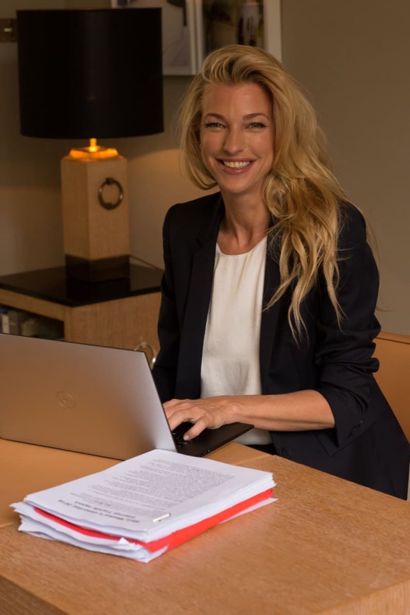 Portrait of Nicole Junkermann, entrepreneur, investor and patron of the arts, at her writing desk